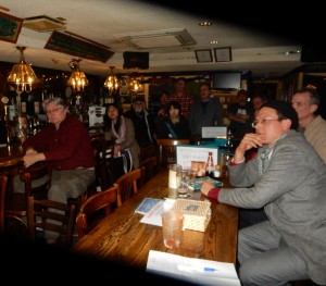 Lawrence Barrow and other members of the audience listen to the wartime words of Zen masters 