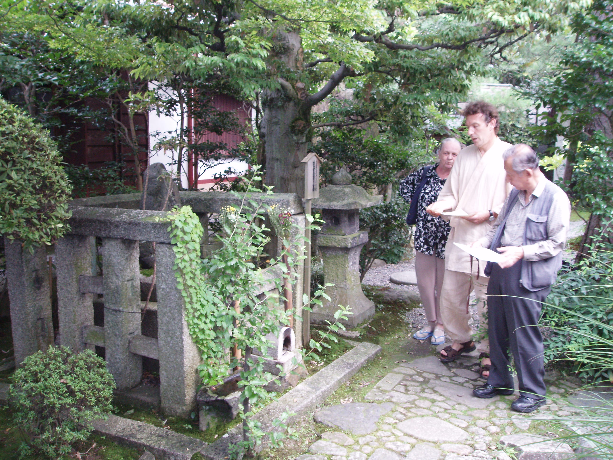 The Kyoto-based Hailstones haiku group present a dedication at Basho's grave at Gichu-ji